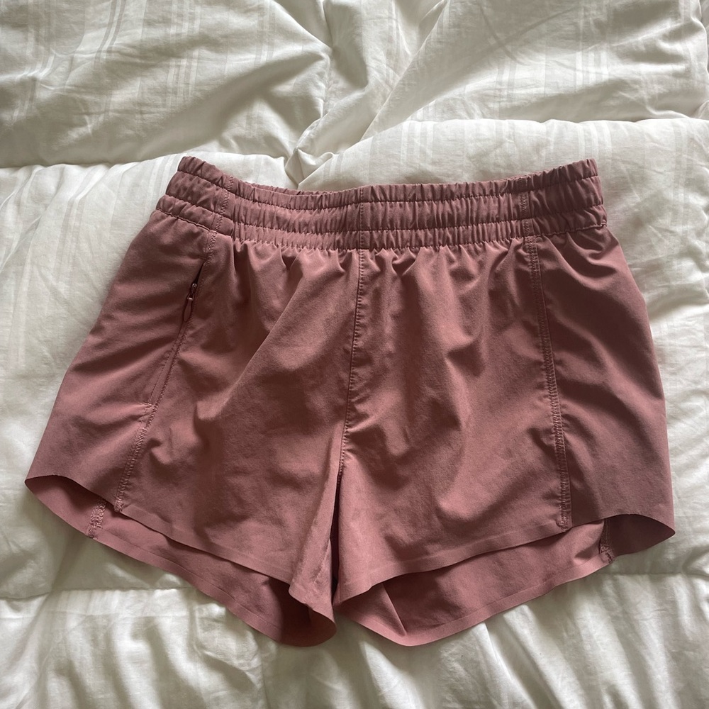 Like new Athleta girl mauve pink running shorts Sz large 12